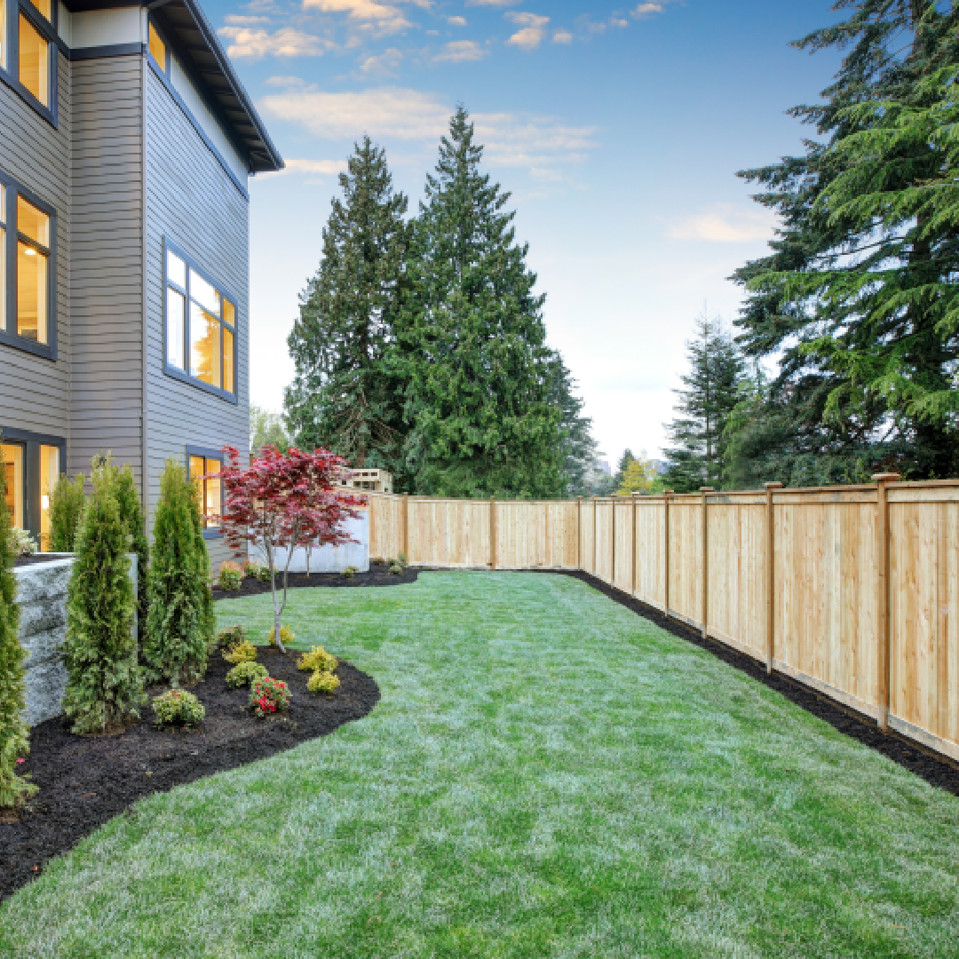 Brown House with White Fence Under White Sky